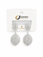 Close-up of crystal teardrop earrings with silver-tone finish